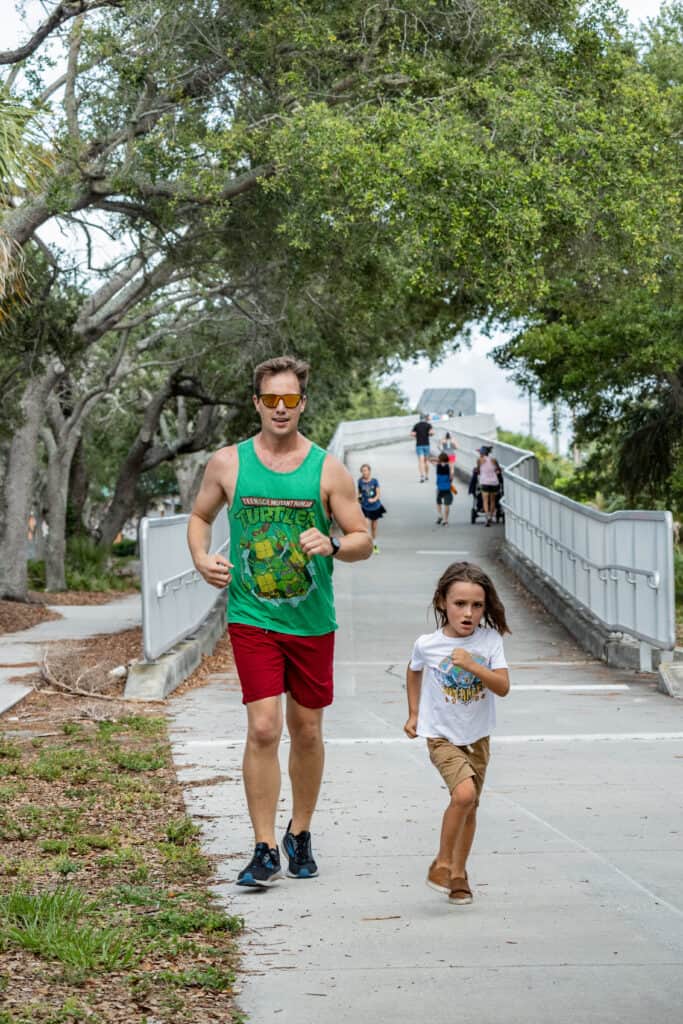 man and child running