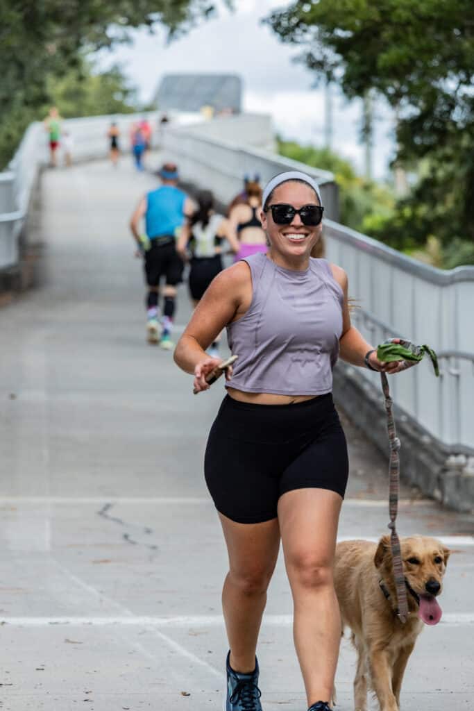 women and dog running