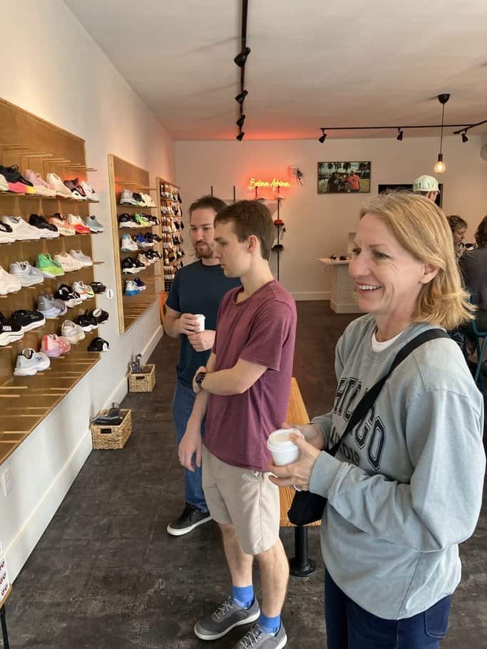 looking at shoes while drinking coffee